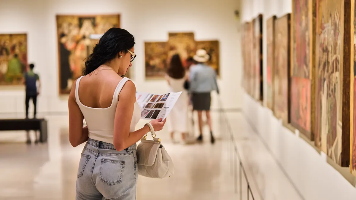 Visitors at an art exhibition in a gallery