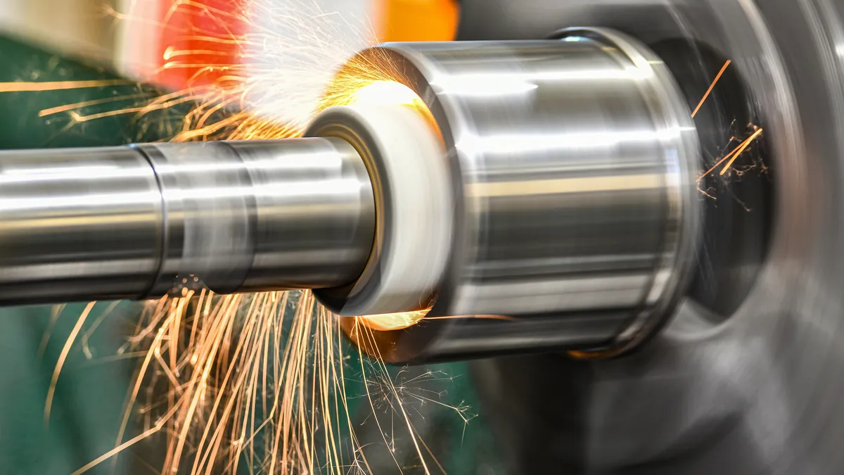 Sparks from a grinding wheel on a cylindrical grinding machine