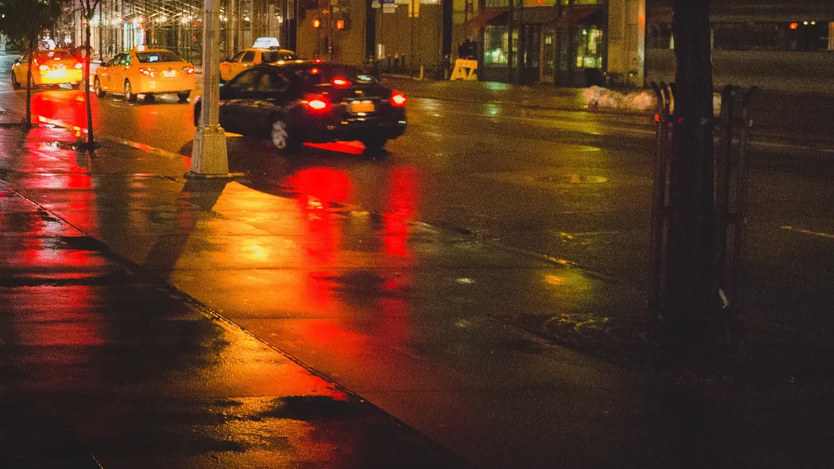 Cars on a city street at night